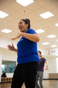 Student teaching Zumba in a group exercise class